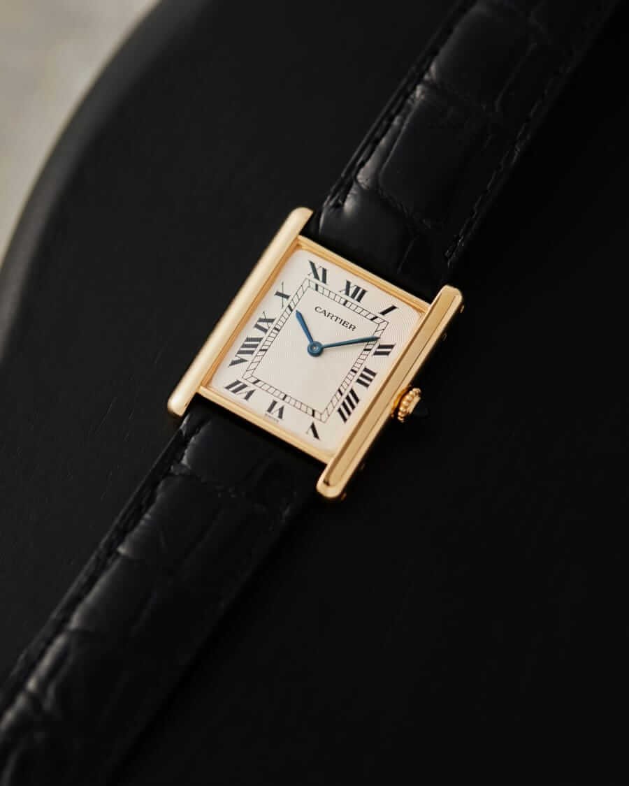 18k Gold Cartier Tank watch close-up