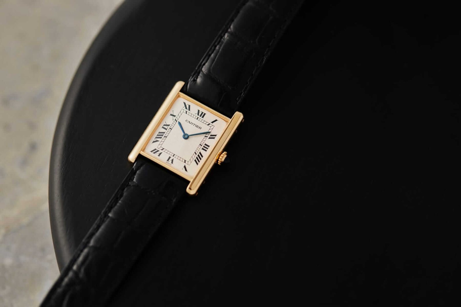 18k Gold Cartier Tank watch close-up