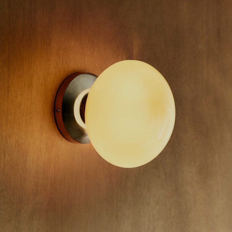 Glass and metal wall light